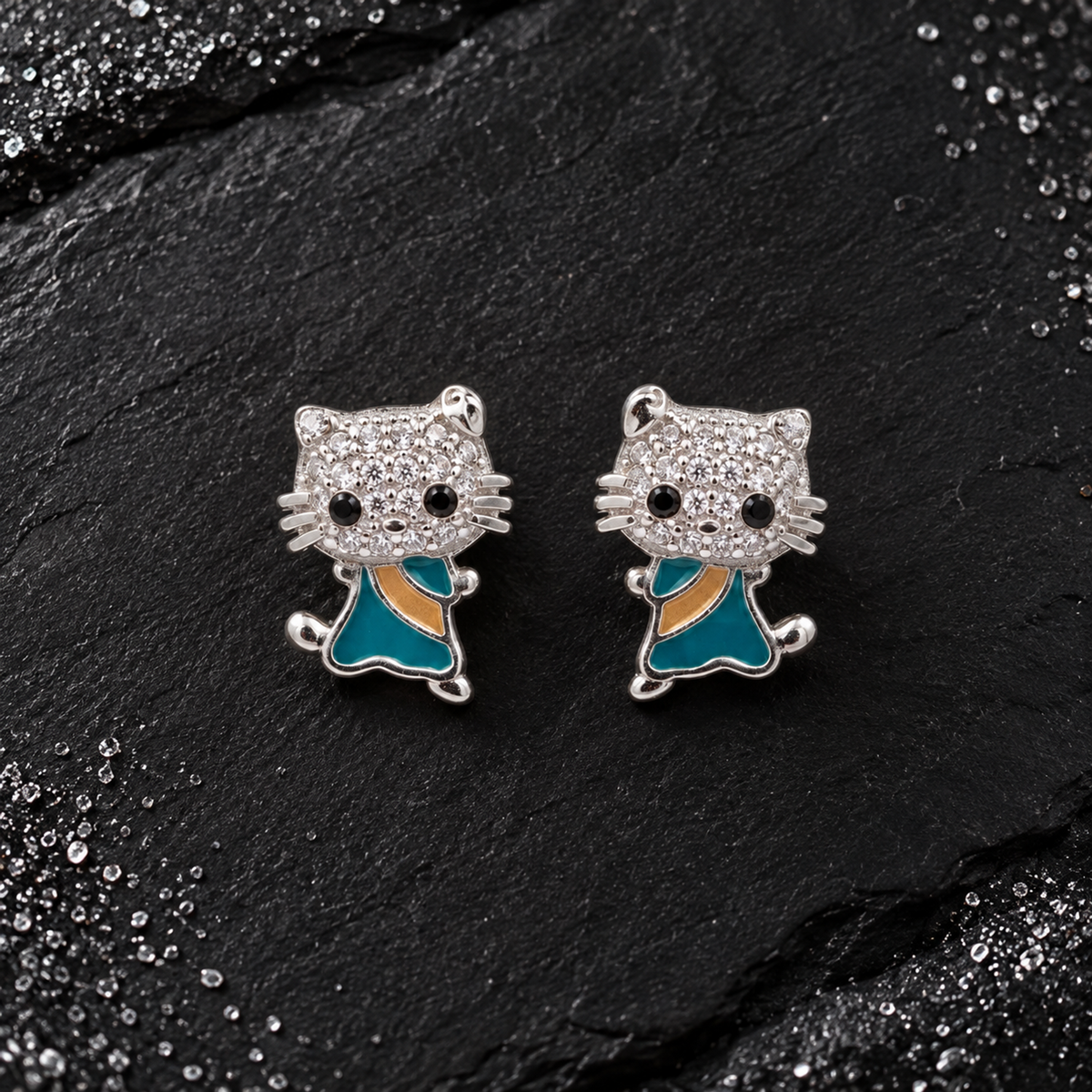 Side view showing a feline silver stud earring worn neatly on an earlobe.