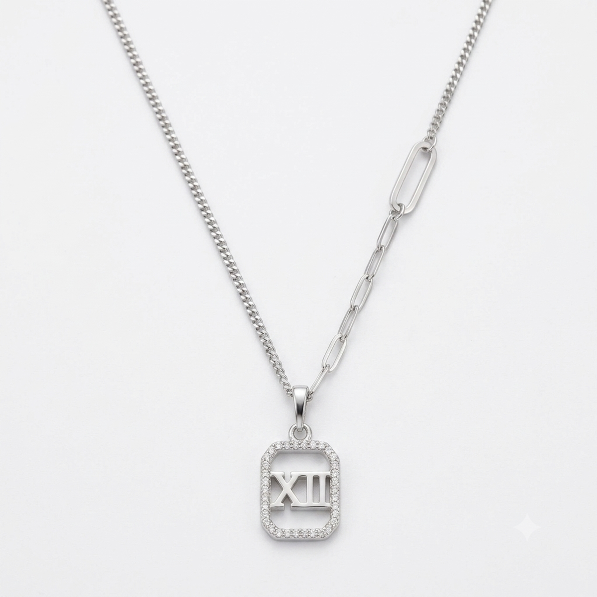Silver Roman numeral XII mother of pearl pendant necklace flat lay on pure white background.