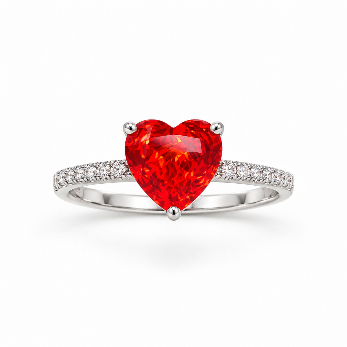 Sterling silver ring with a red heart stone on a seamless white background.