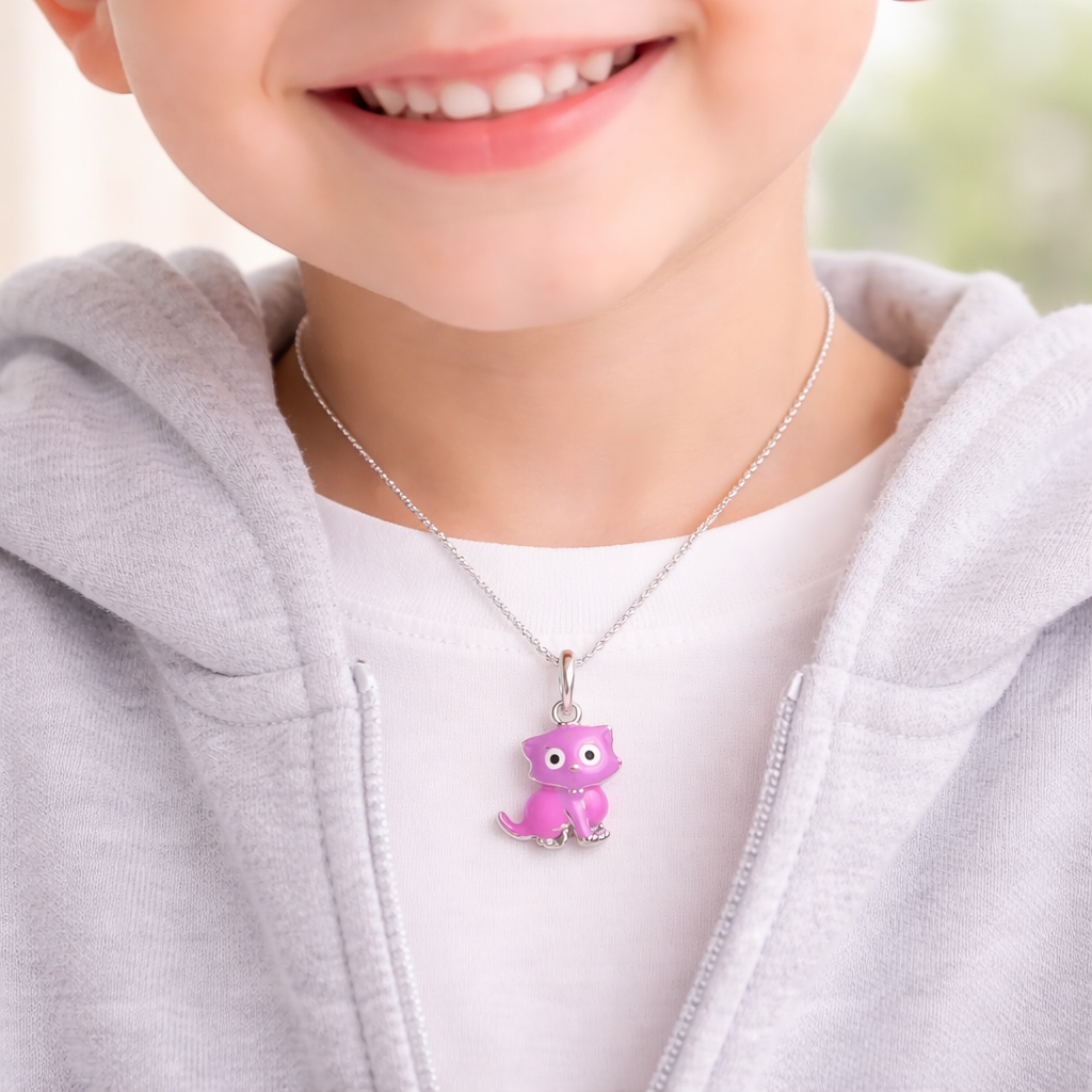 Child wearing a necklace with a purple dinosaur pendant