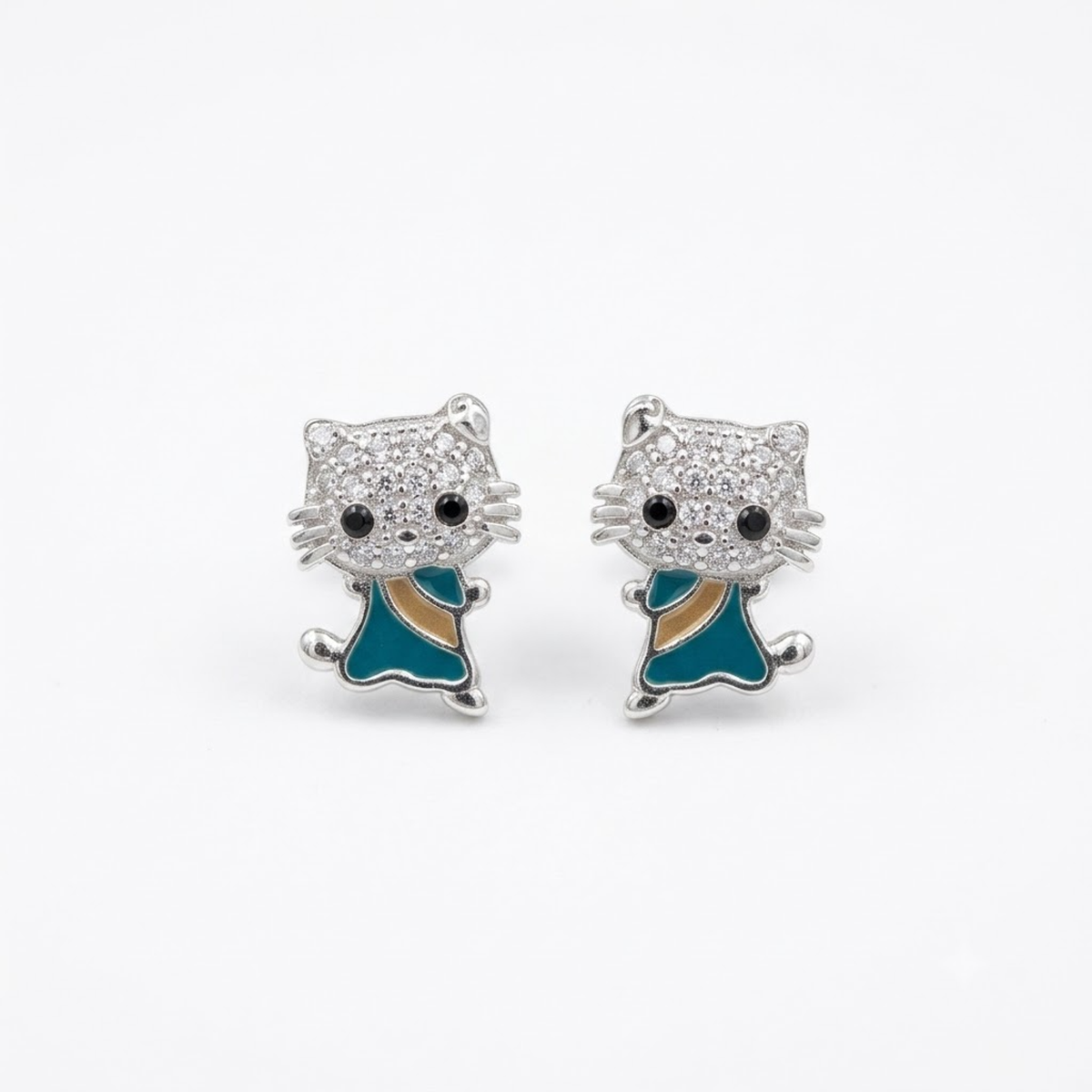 Pair of sterling silver feline stud earrings with pavé stones resting on a solid white background.