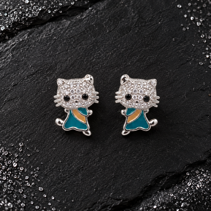 Side view showing a feline silver stud earring worn neatly on an earlobe.