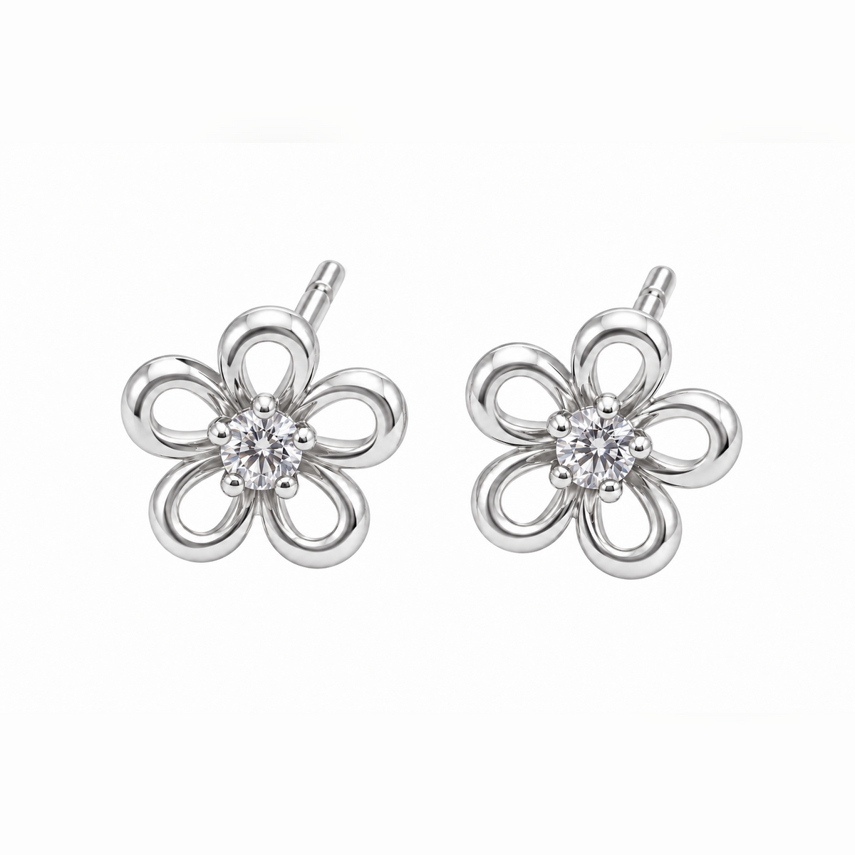 Pair of silver openwork floral stud earrings centered on a pure white background.