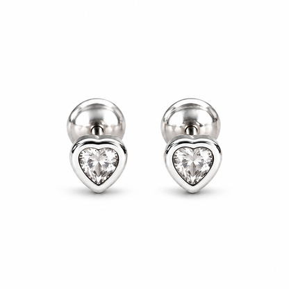 Pair of silver heart bezel stud earrings on a pure white background.