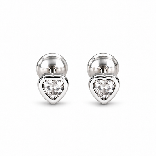 Pair of silver heart bezel stud earrings on a pure white background.