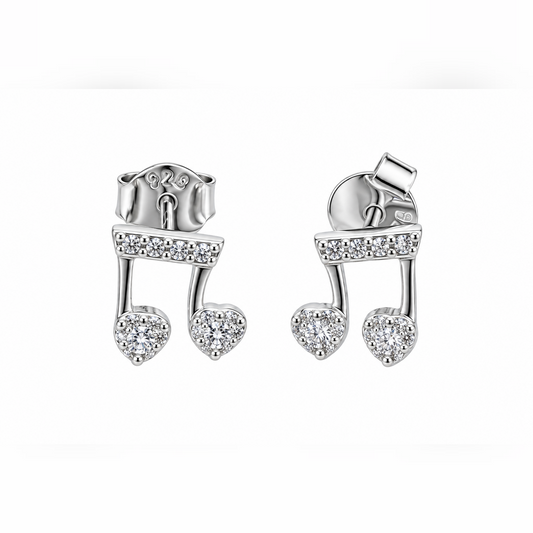 Pair of silver musical note stud earrings with cubic zirconia stones on a seamless white background.