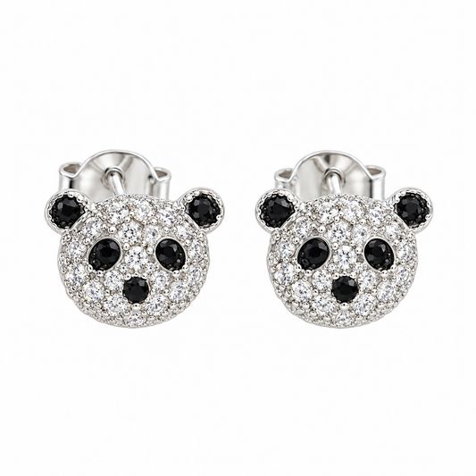 Pair of sterling silver panda stud earrings with clear and black cubic zirconia on a white background.