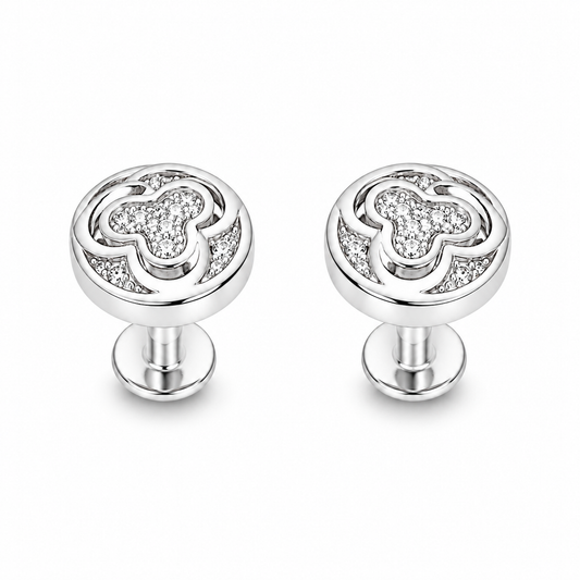 Pair of silver pave swirl stud earrings on a seamless white background