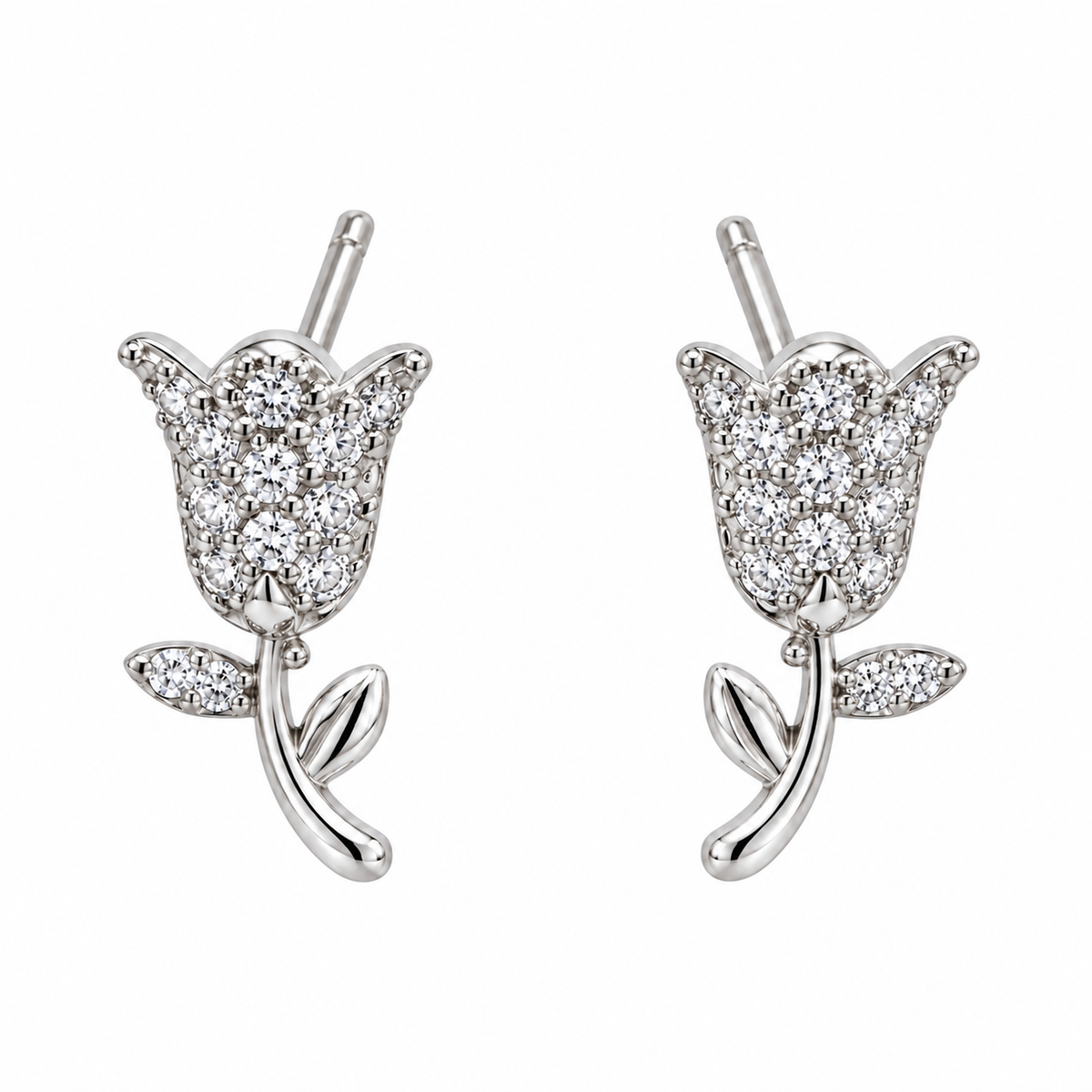 Pair of silver tulip stud earrings centred on a seamless white background.