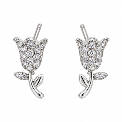 Pair of silver tulip stud earrings centred on a seamless white background.