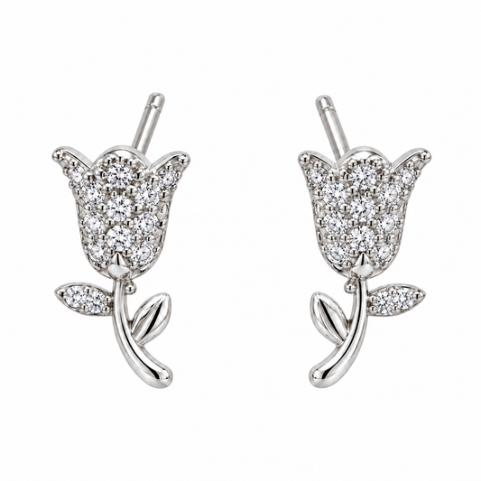 Pair of silver tulip stud earrings centred on a seamless white background.