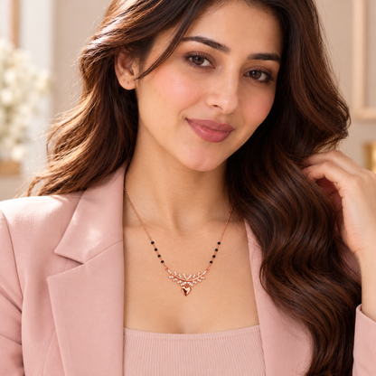 Close-up of Noya wearing the rose gold infinity mangalsutra against an ivory blouse.