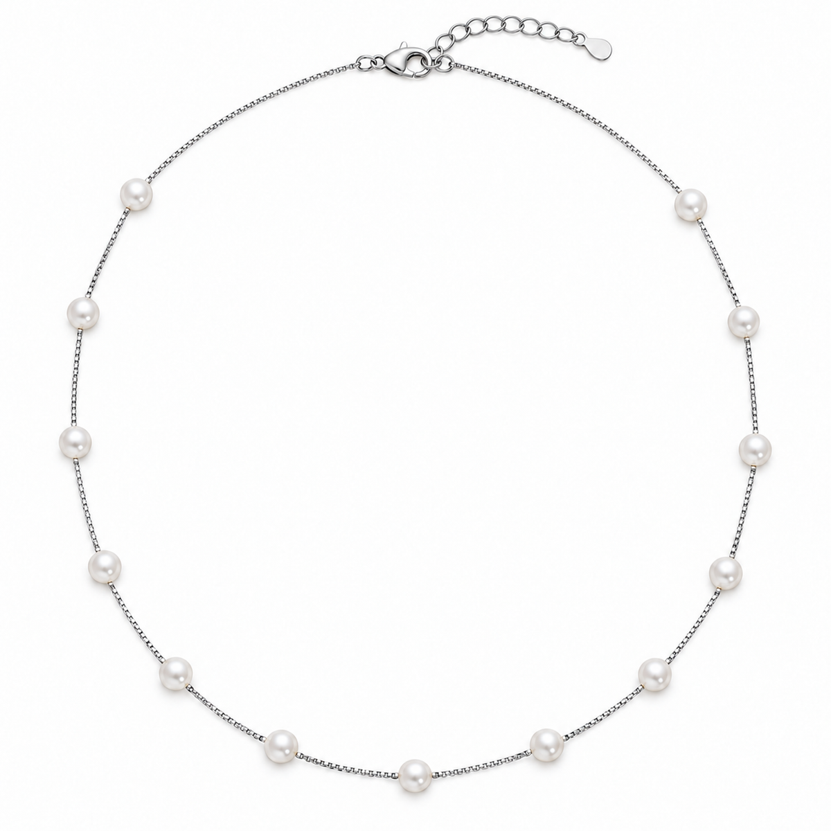 Silver box chain necklace with seven white pearls laid flat on a white background.
