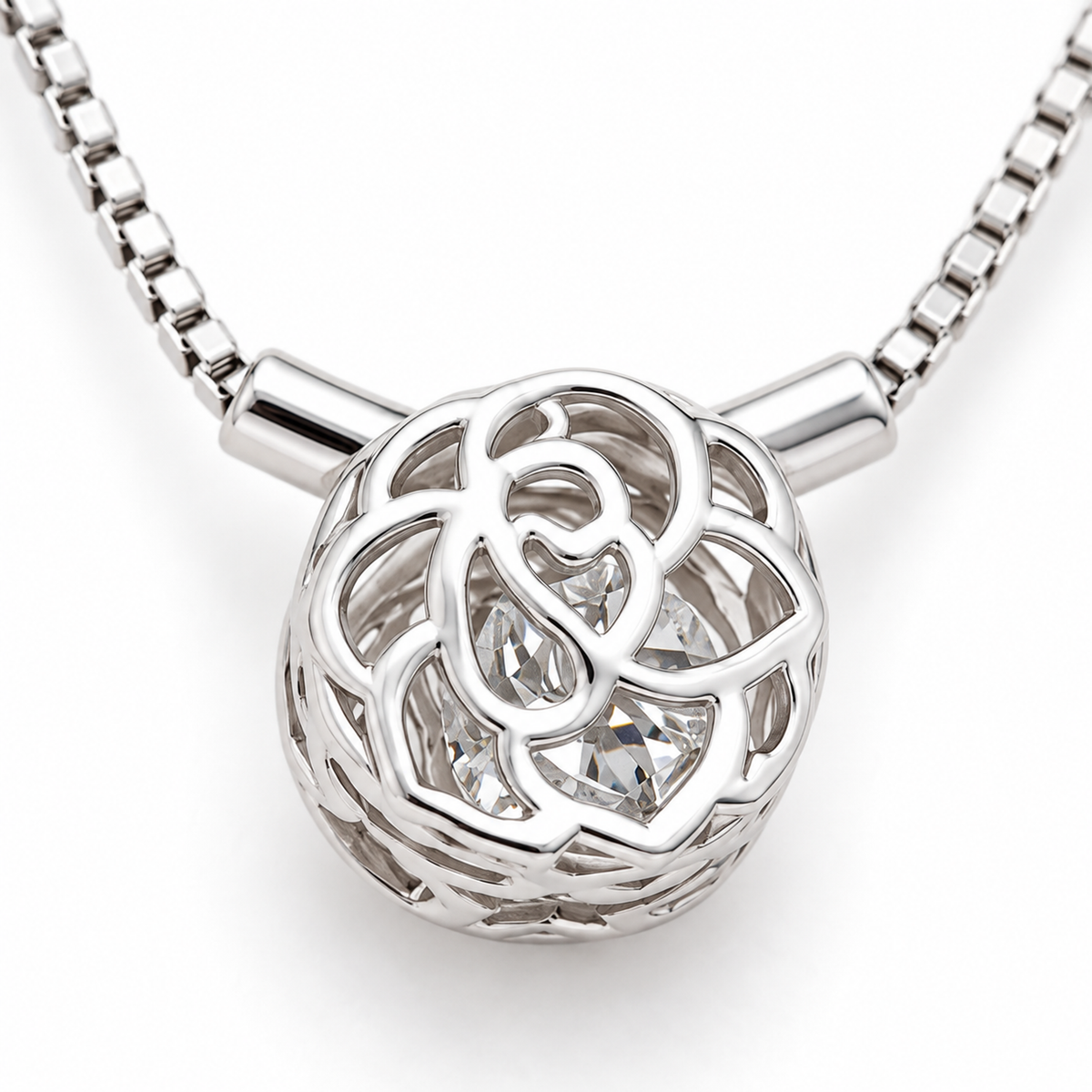 Macro shot detailing the openwork rose-petal cage and the sparkling central cubic zirconia stone.