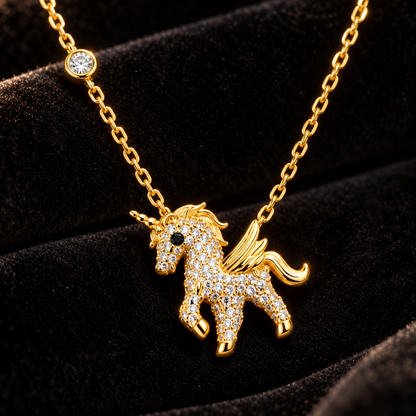 Macro view of gold winged unicorn pendant set with sparkling pave stones.