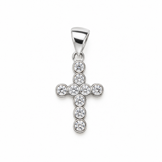 Polished 925 sterling silver Latin cross pendant set with clear round bezel stones on white background.