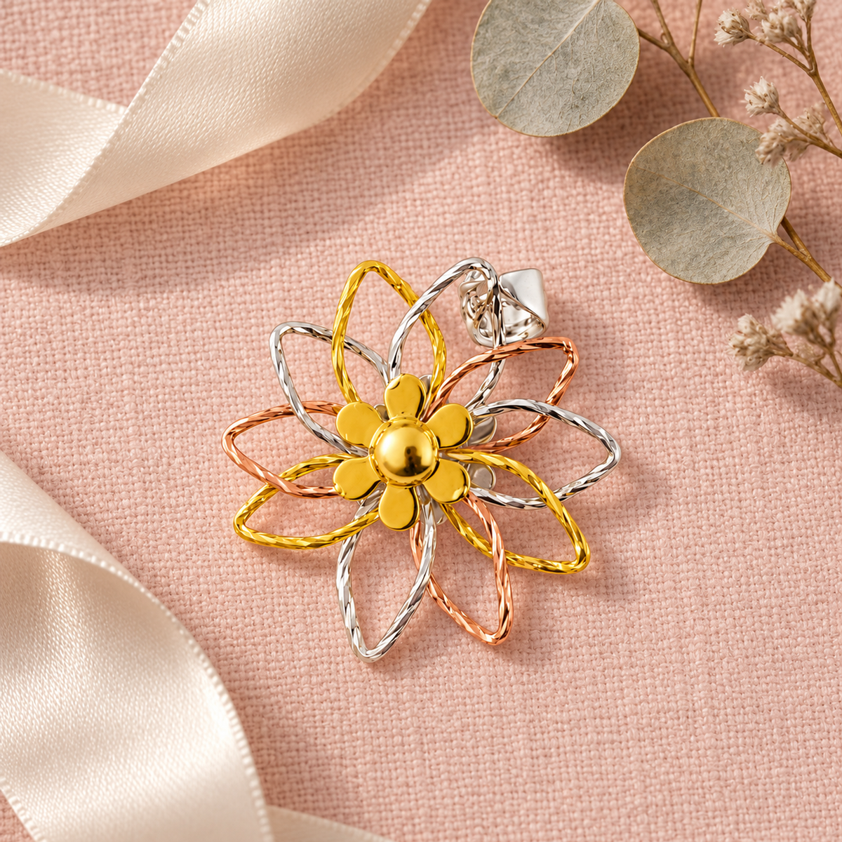 Floral silver pendant on a dark ceramic surface with subtle warm accents.