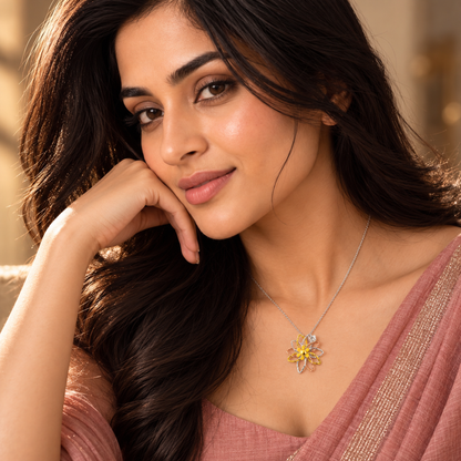 Model in a rose saree wearing the multi-tone silver flower pendant, looking forward.