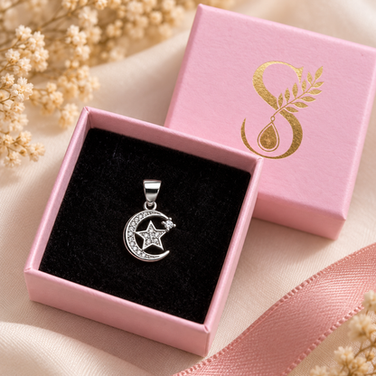 Silver pendant displayed inside a pale pink Silvanya jewellery box with black velvet.