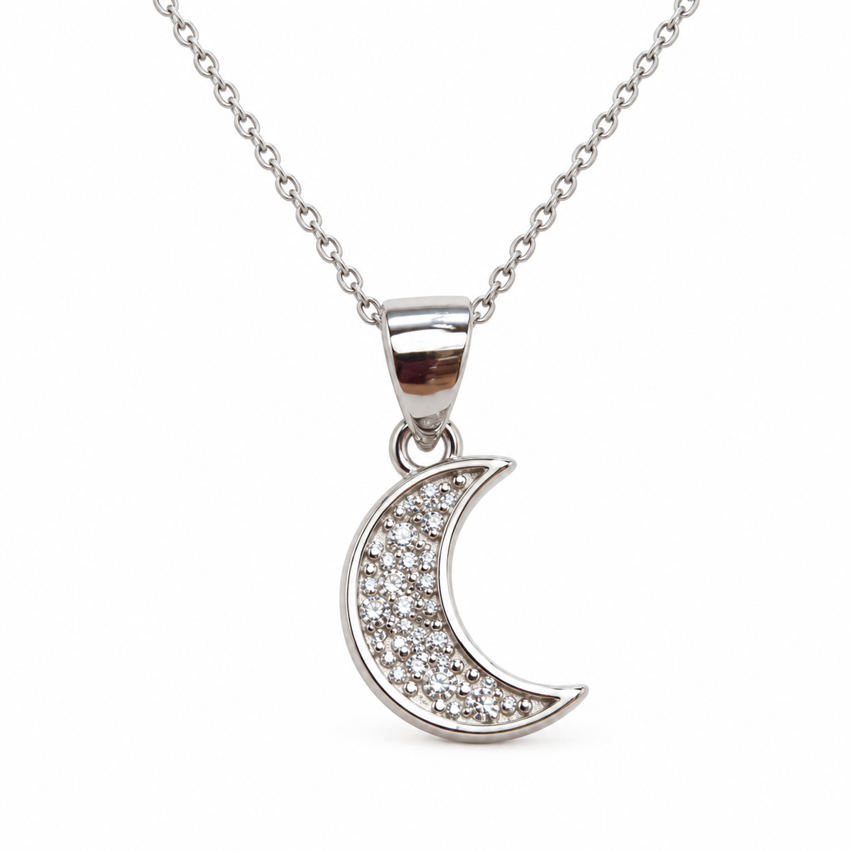 Silver crescent moon pendant with pave stones on a white background.
