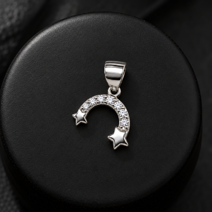 Silver arch pendant on a matte black ceramic pedestal with crisp highlight reflections.