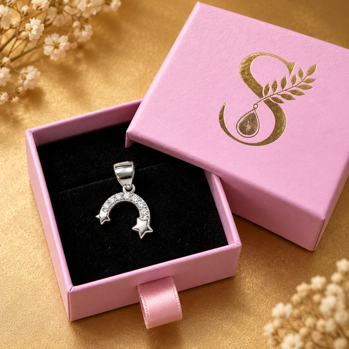 Silver twin star pendant displayed inside a magenta pink drawer gift box on black velvet.