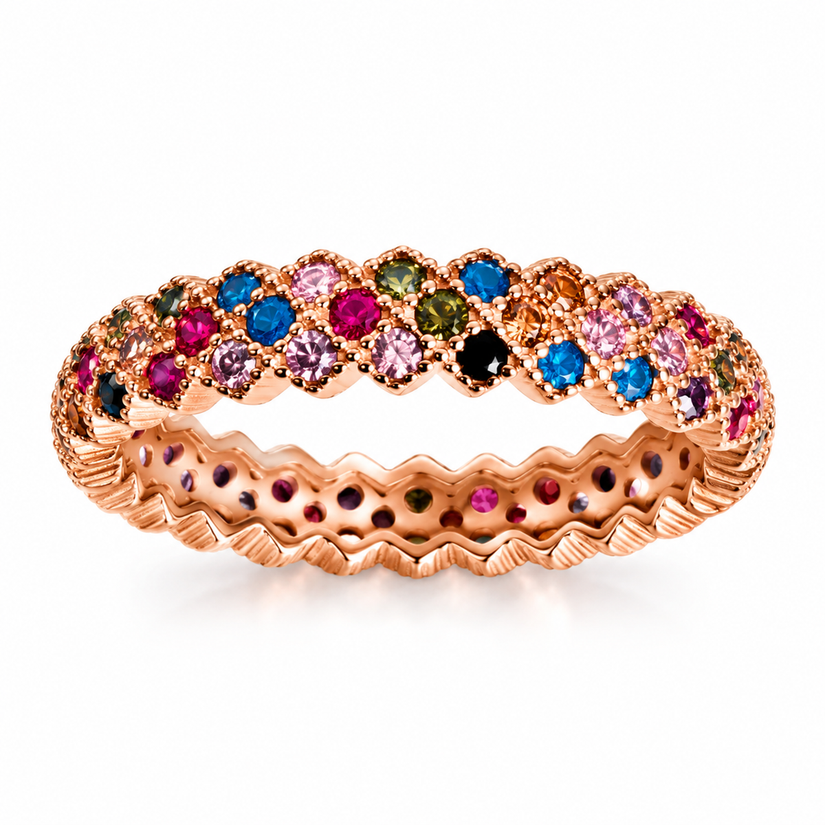 Multicolour eternity band resting on an ivory travertine slab in warm sunlight.