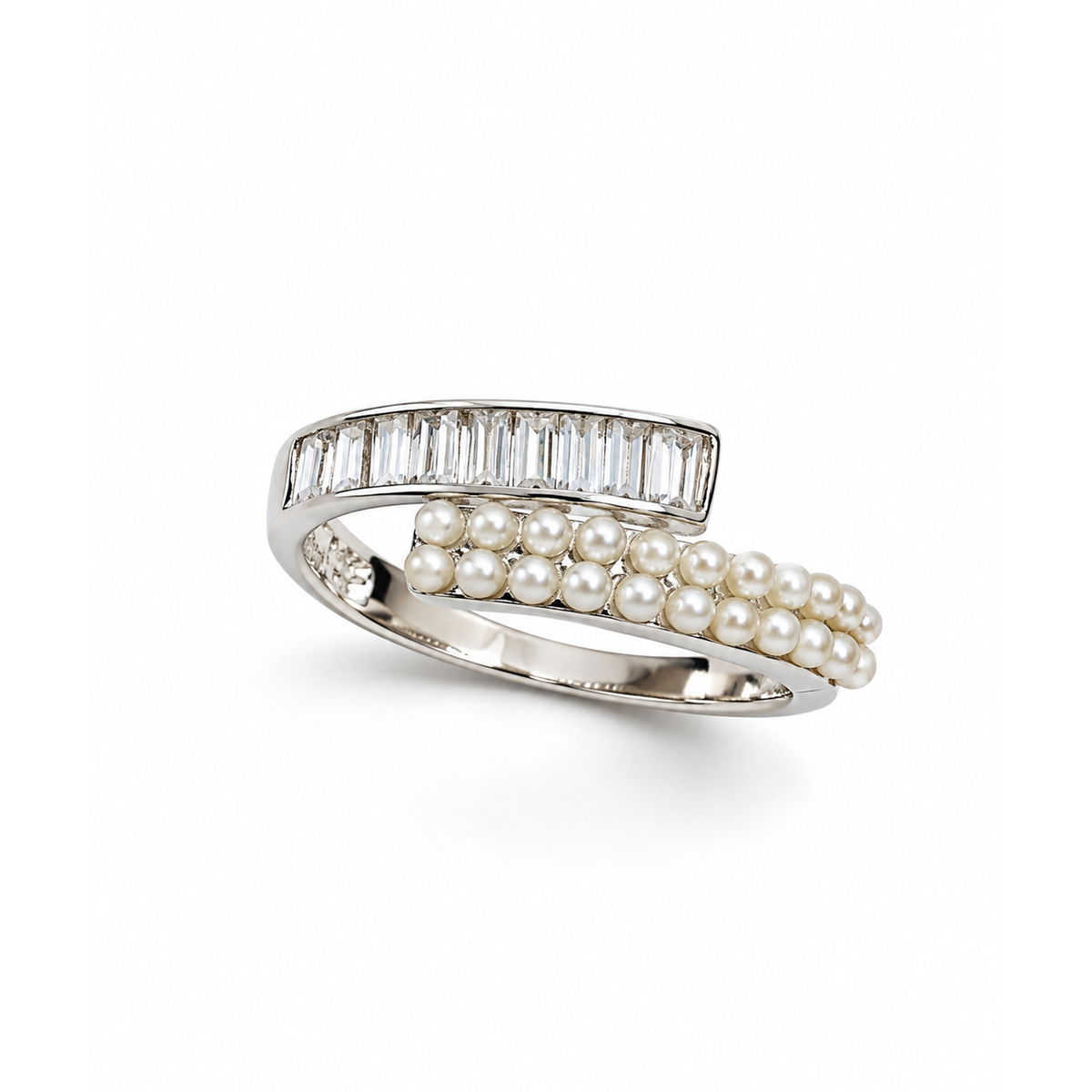 Sterling silver bypass ring with baguette stones and seed pearls on a pure white backdrop.