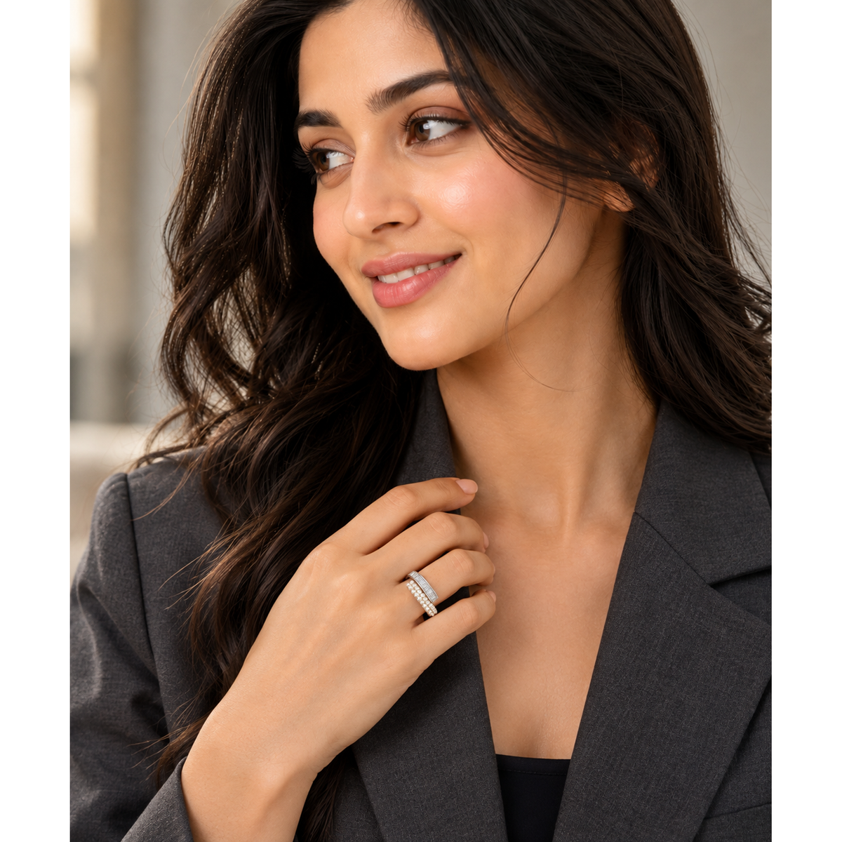 Model wearing a sterling silver bypass ring on her ring finger.