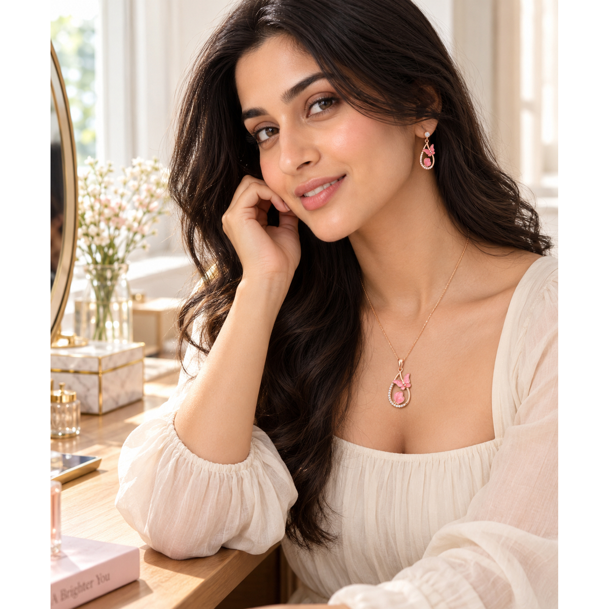 Model Noya wearing the rose gold pink butterfly pendant necklace and matching drop earrings.