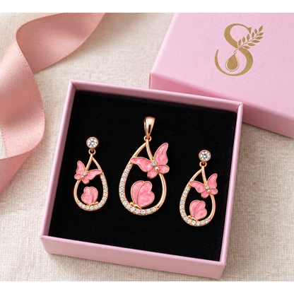 Rose gold butterfly jewellery set presented in a pink Silvanya gift box with black velvet interior.