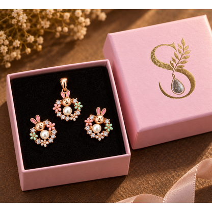 Rose gold bunny jewellery set inside a pale pink Silvanya gift box with black velvet lining.