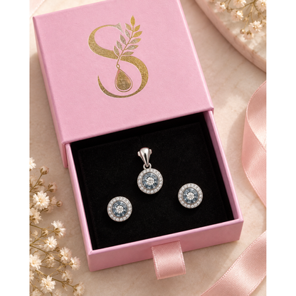 Jewellery set laid inside a pink velvet-lined gift box.