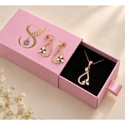 Magenta Silvanya drawer box half open with the pendant inside and earrings on the lid.